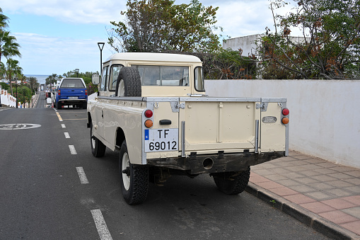 Corralejo, Fuerteventura, Spain, November 24, 2023 - An old beige Land Rover Series IIa (1968-1971)