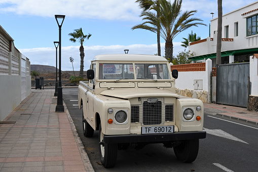 Corralejo, Fuerteventura, Spain, November 24, 2023 - An old beige Land Rover Series IIa (1968-1971)