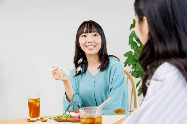 istock Asian women having their meal in a restaurant 1837036145