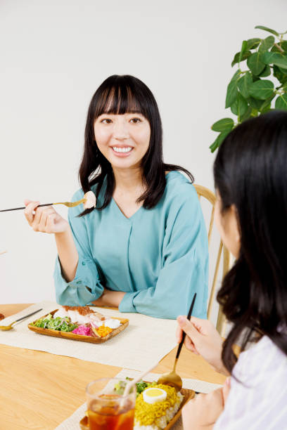 istock Asian women having their meal in a restaurant 1837036494