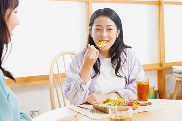 istock Asian woman having lunch in a restaurant 1837036639