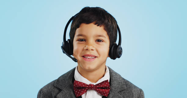 istock Face, studio or child consultant in call center talking or networking for telecom on blue background. Young, contact or friendly kid sales agent in communication or conversation at customer service 1837041834