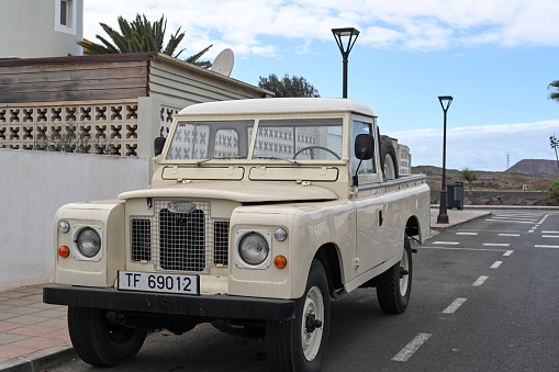 Corralejo, Fuerteventura, Spain, November 24, 2023 - An old beige Land Rover Series IIa (1968-1971)