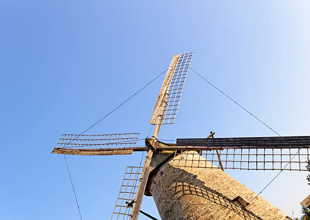 istock Old wooden mill against the blue sky 183705085