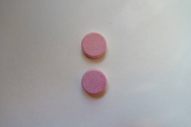istock View of two big pink oral probiotic tablets from above 1837051388