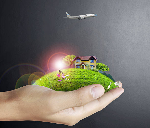 istock human hand holding house ands nature 183706399