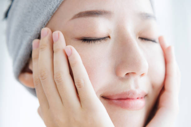 istock Young Asian woman touching her face 1837082803