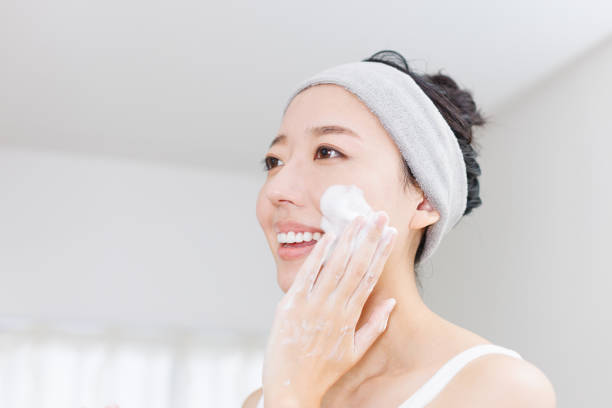 istock Young Asian woman using facial cleansing foam 1837085910