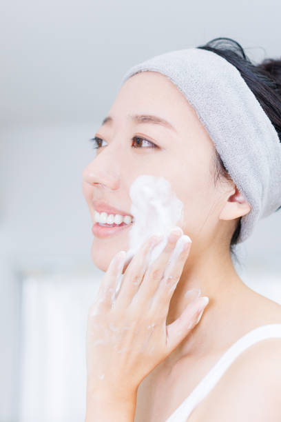 istock Young Asian woman using facial cleansing foam 1837085914