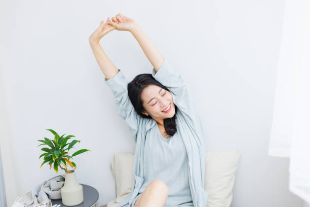 istock Young Asian woman do stretching on her bed 1837086939