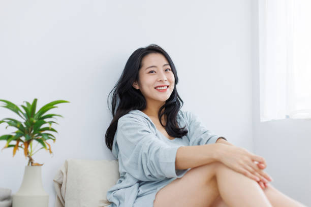 istock Young Asian woman chilling at home 1837087981