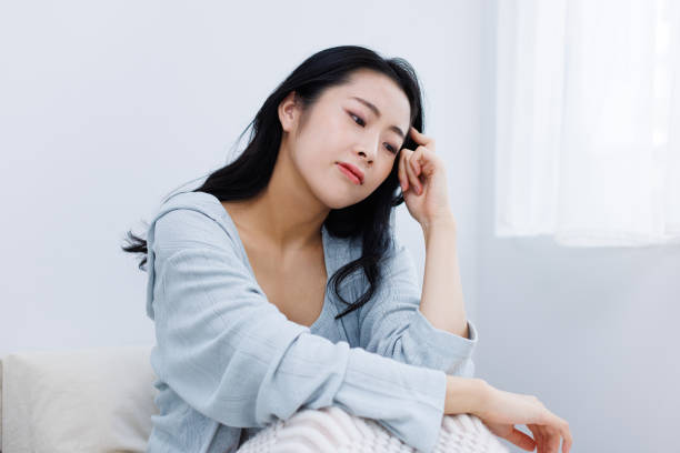 istock Young Asian woman feeling depressed in her bed 1837088602