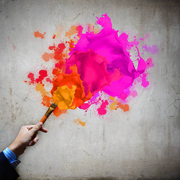 istock Human hand holding paint brush 183709125