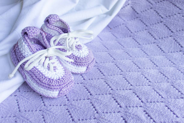Knitted booties socks on a white background for newborns