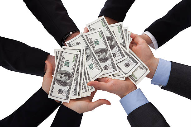 istock Group Of Businesspeople Holding Banknote 183709934