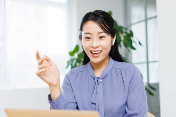 istock Young Asian woman having a videoconference meeting 1837099378