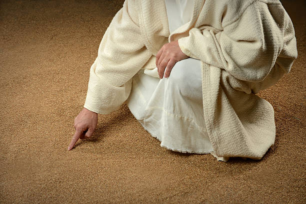 istock Jesus Writing in the Sand 183710335
