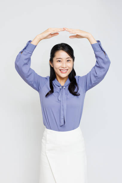 Young Asian woman with Yes gesture