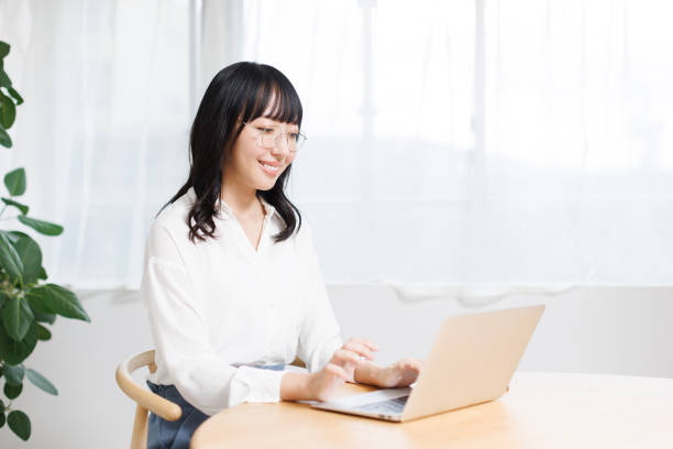 istock Young Asian woman working at home 1837111248