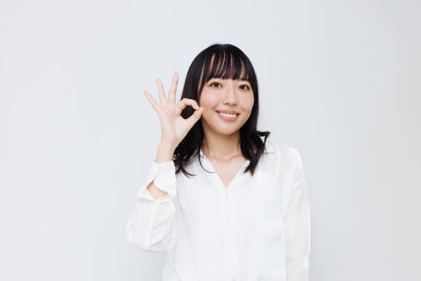 istock Young Asian woman showing Okay gesture 1837112863