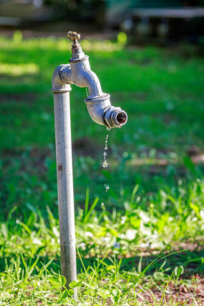 istock Metal tap dripping water drops 183712375