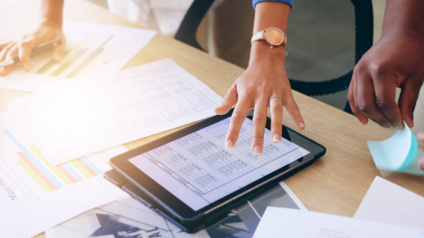 istock Finance analytics, screen and tablet with hands of business person and infographic. Table, teamwork and information of company with graphs, statistics and collaboration of employee planning 1837133245