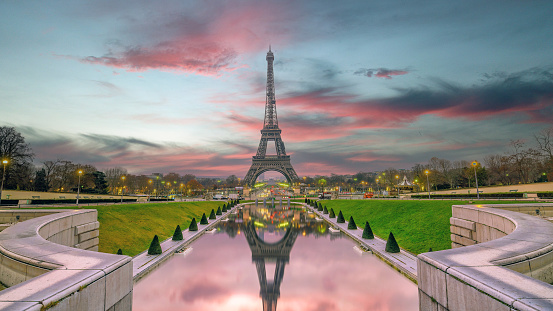 Paris Eiffel Tower and river Seine at sunset in Paris, France. Eiffel Tower is one of the most iconic landmarks of Paris. Postcard of Paris