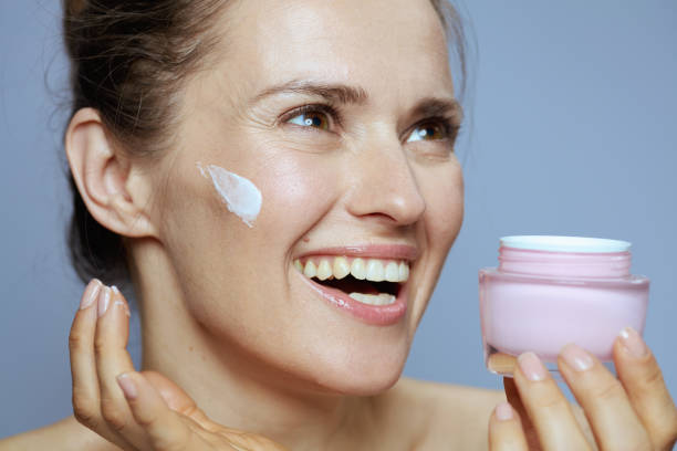 istock happy modern woman with cosmetic cream jar 1837148475