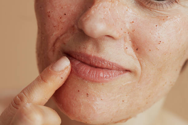 istock Closeup on young woman with face scrub 1837148476