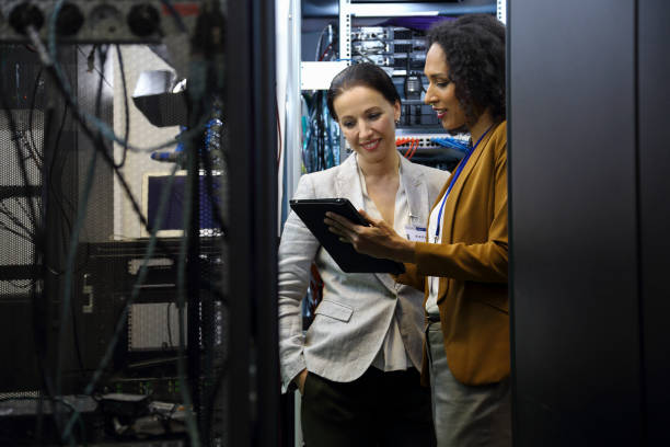 istock IT professionals having meeting in server room 1837183093