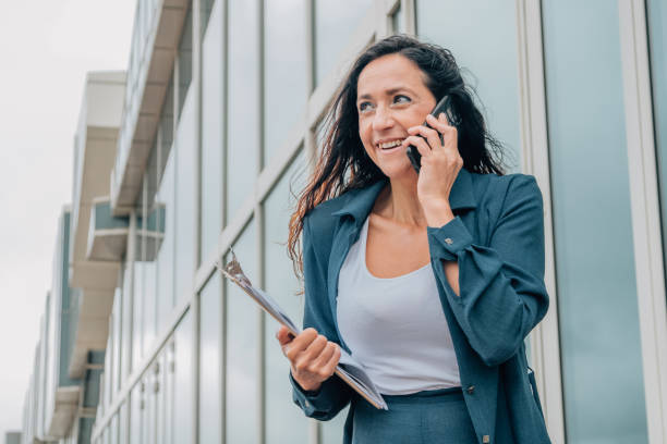 istock business woman talking on mobile phone with copy-space 1837184687