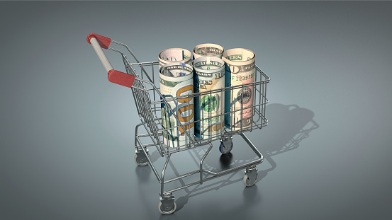Symbolic image: Shopping cart with US dollar bills