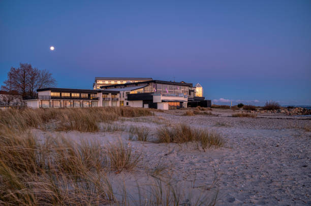 Marienlyst beach hotel en early morning and the shoreline of  the Sound Oresund, Denmark, November 28, 2023