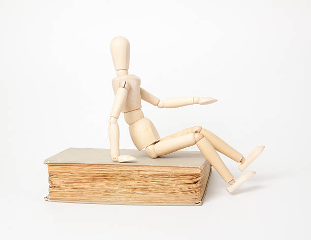 istock Wooden man and book 183720111