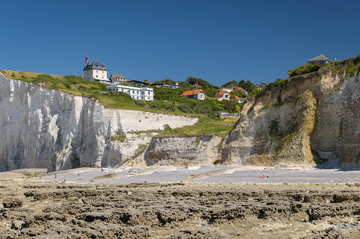 Ault, France - July 10, 2022: Coast and high cliffs near Ault on a sunny day in summer, blue sky, northern France
