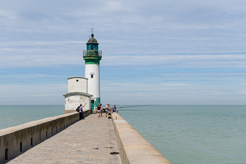 Le Treport, France - July 17, 2022: The lighthouse of Treport on a sunny day in summer