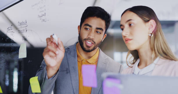 istock Planning, talking strategy and business people with notes, brainstorming and work agenda. Conversation, teamwork and a businessman and woman speaking about company innovation, moodboard and ideas 1837210147