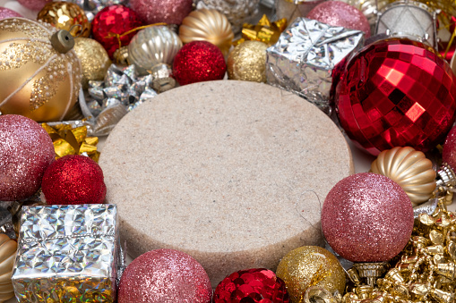 Podium with Christmas Decorations. Top View Empty Round Form Pedestal Display for Product Presentation. Xmas Ornaments Background Frame. New Year Scene Showcase Backdrop. Stand with Shiny Bauble, Balls, Bulbs. Top View, Frame. Colorful christmas ornaments background from above. Bokeh new year and xmas decoration glittering and shining. Top view. Merry Christmas. Flat lay with Christmas balls. Sparkling Effect. Shimmering. Happy new year frame. Turn, Spin. Turntable. Noel. Christmas frame. Spinning