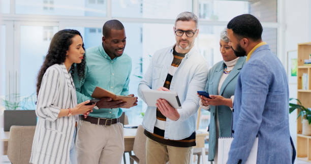 istock Collaboration conversation, tablet and business people, manager or team work on analysis, strategy or project insight. Cooperation, teamwork or workplace staff review research, design or startup idea 1837223792