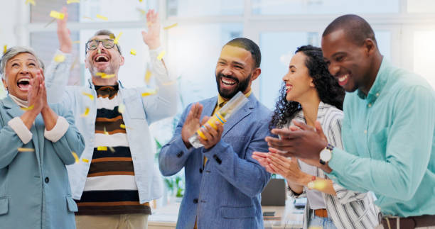 istock Creative people, applause and confetti in celebration for winning, team achievement or unity at office. Group of happy employees clapping in success for teamwork, promotion or startup at workplace 1837223796