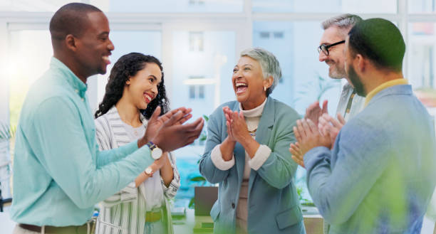 istock Creative people, meeting and applause in celebration for winning, team achievement or unity at the office. Group of happy employees clapping in success for teamwork, promotion or startup at workplace 1837223798