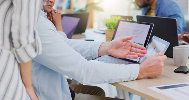 istock Mentor, collaboration and technology with helping an employee with work or project for team. Male professional, intern and learning with tech for teamwork at company together with teaching for job. 1837224854