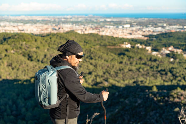 istock Man enjoys the scenery from the mountain. 1837225118