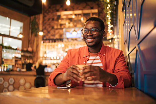 istock young black man in cafe drink coffee 1837253740