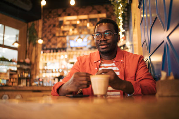 istock young black man in cafe drink coffee 1837259112
