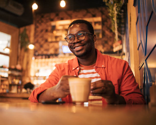 istock young black man in cafe drink coffee 1837259647