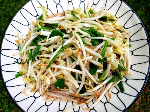 Stir-fried bean sprouts on white background