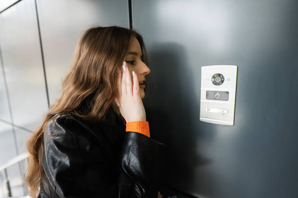 istock Young lady stand calling on intercom at institution department firm. 1837270207