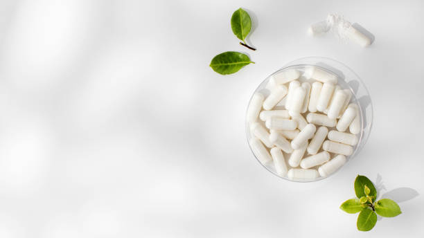 istock White capsules with minerals or food additives with an organic composition. Vitamins. Copy space 1837276647