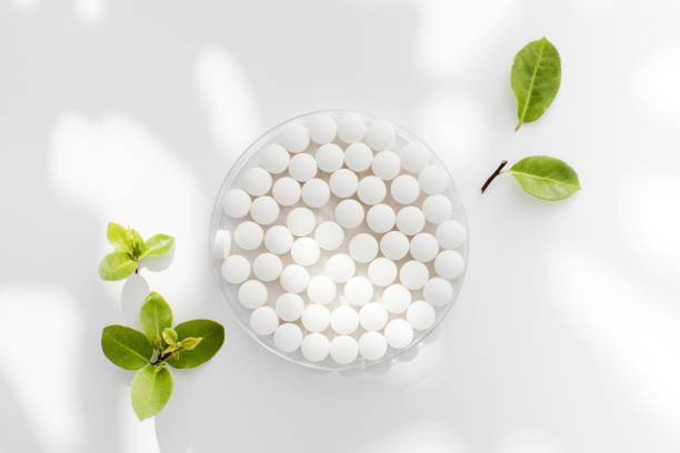 istock White round tablets with a natural composition. Tablets, minerals and vitamins. 1837277751